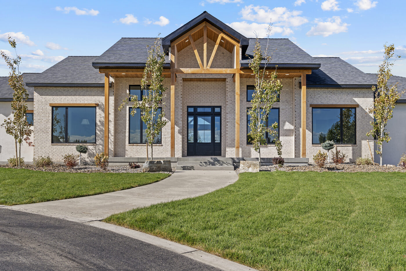 Timber frame covered entry with all-brick exterior — 560 Partridge Lane Rexburg ID